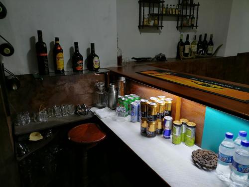 a bar with bottles of alcohol on a counter at The Kingston Court in Kandy