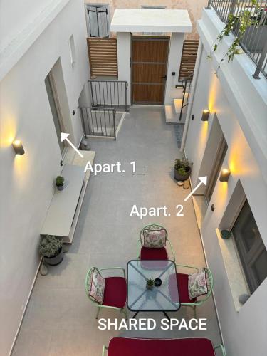 an overhead view of a balcony with a shared space at Kazarma Central Suites - Apartment Complex in Egina