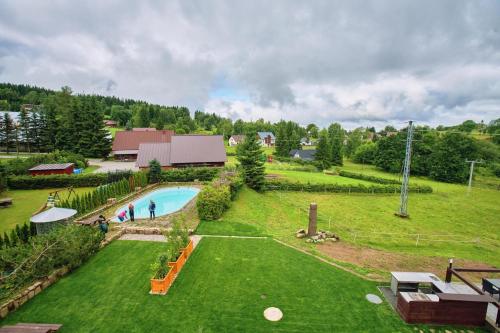 an aerial view of a yard with a swimming pool at Hotel Na Vyhlídce in Kořenov