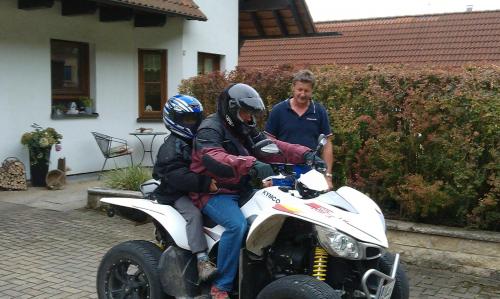 a group of people riding a dirt bike at Ferienwohnungen Holder in Anhausen