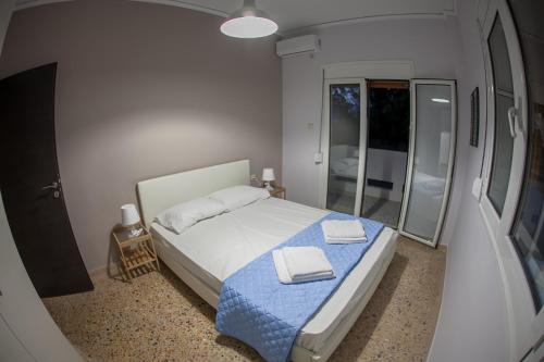 Ένα ή περισσότερα κρεβάτια σε δωμάτιο στο Lak Alepochori Homes