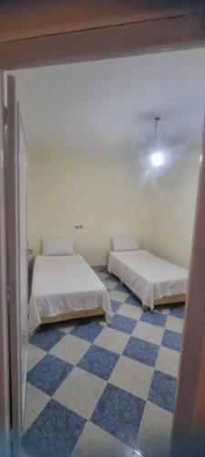 En eller flere senge i et værelse på Gite El Qalaa - مأوى القلعة