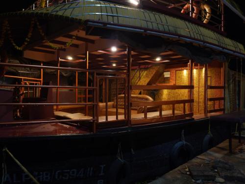 a room with a bed in the middle of a building at Alice Lake Promise in Alleppey