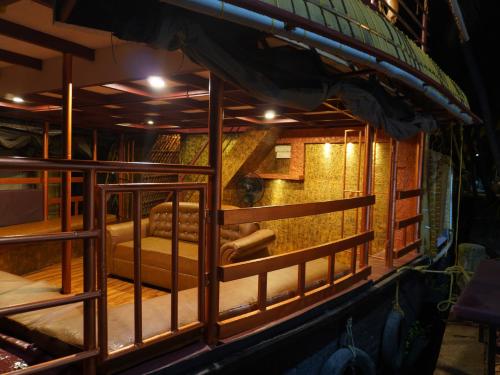 a room with a cage with a couch in it at Alice Lake Promise in Alleppey