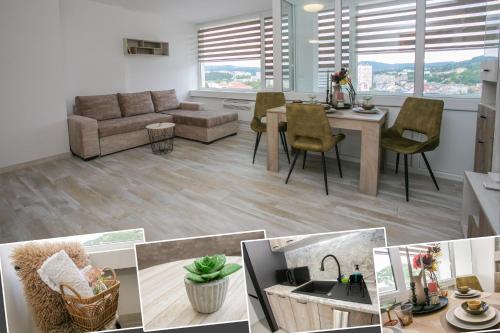 a living room with a couch and a table at Balkan Tower Deluxe Candy in Gabrovo
