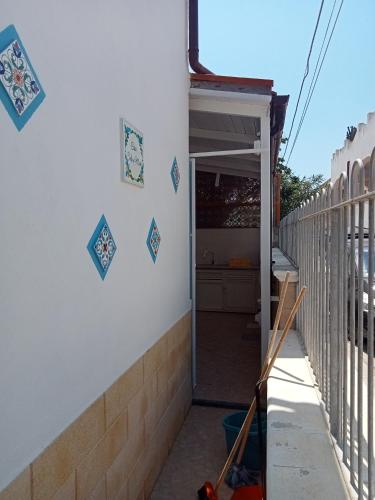 an open door to a garage on the side of a house at Casa Sole e Mare indipendente a Triscina in Triscina