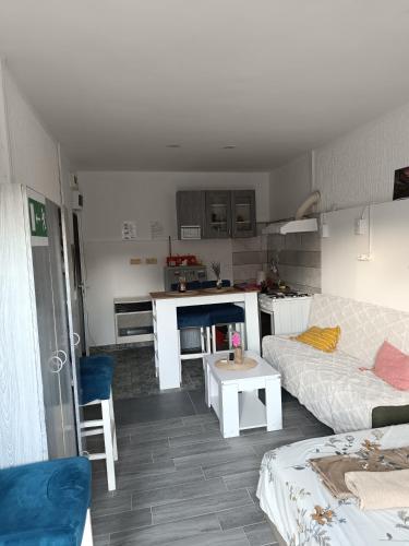 a living room with a couch and a table at Prenoćište Inđija Hrvić in Inđija