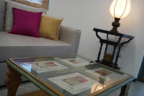 a living room with a couch and a glass table at Seilan in Colombo