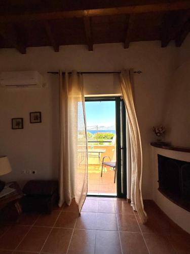 a room with a door open to a patio at The Twin Houses in Metamórfosis
