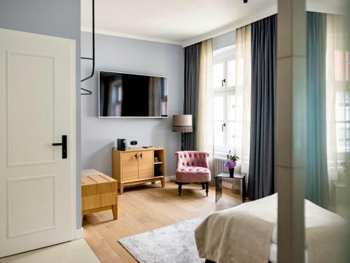 TV a/nebo společenská místnost v ubytování Boutiquehotel Petuh