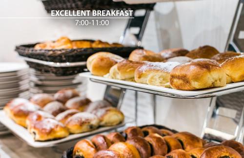 a bunch of pastries on trays in a bakery at Cosmopolitan Bobycentrum - Czech Leading Hotels in Brno