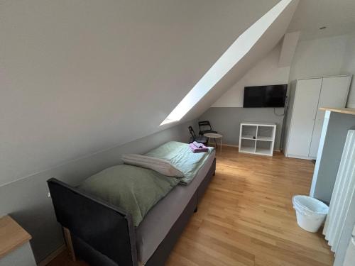 a bedroom with a bed in a room at Zimmer für 3 Personen, Kühlschrank-Bad in Meine