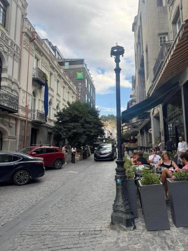 a street light on the side of a city street at Apartment for Daily Rent in the Heart of Tbilisi in Tbilisi City
