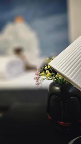 a close up of a table with flowers on it at Orrefors Vandrarhem in Nybro