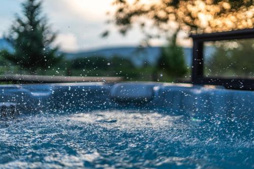 a close up of a pool with water droplets at Panorama Point - Gorgeous views, hot tub, theater in Davis