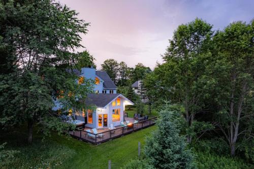 an aerial view of a house with lights on at Panorama Point - Gorgeous views, hot tub, theater in Davis