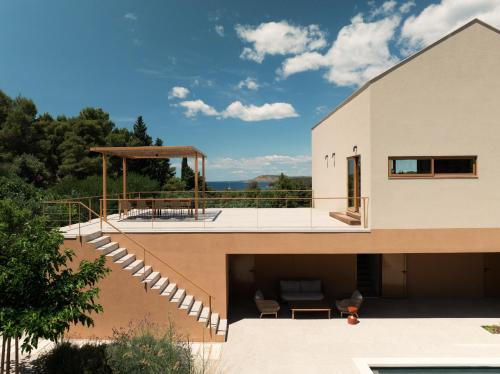a house with a balcony with a view at Nine Olives Hvar in Stari Grad