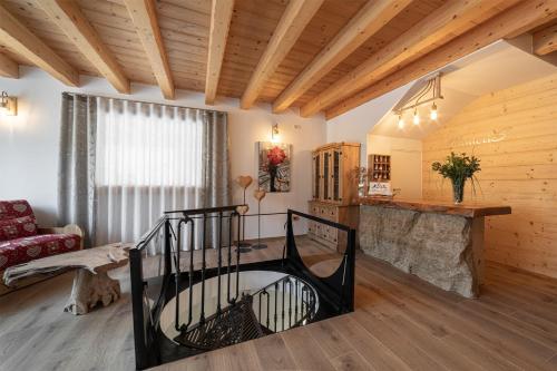 a living room with a spiral staircase in a house at ManicriS in Conco