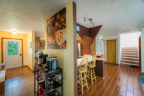 a kitchen and a living room with a table and chairs at Panorama Point - Gorgeous views, hot tub, theater in Davis