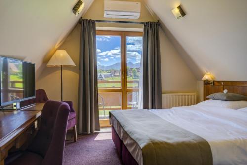 Postel nebo postele na pokoji v ubytování Hotel REDYK Ski&Relax