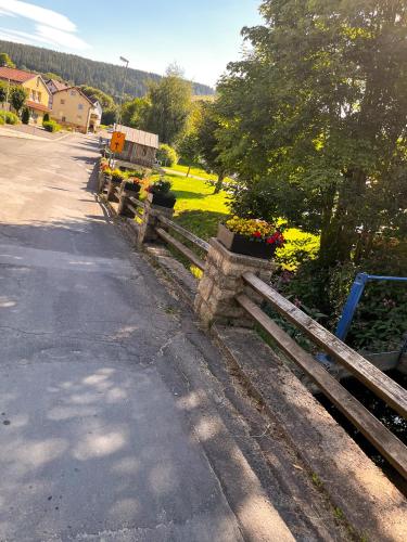 a row of wooden fences on the side of a road at Apartment Mary Mehlmeisel in Mehlmeisel