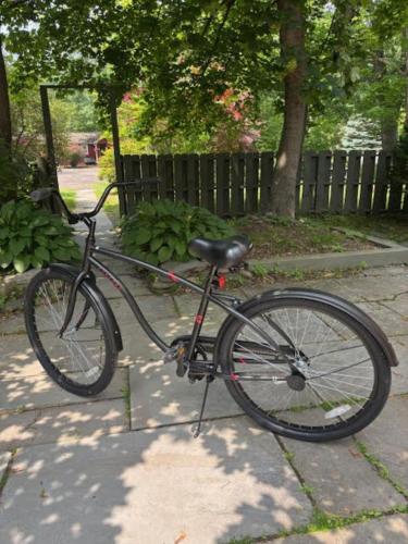 a bike parked on a sidewalk next to a fence at Phoenicia Lodge in Phoenicia