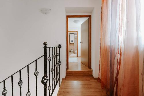a hallway with a stairway leading to a bathroom at Villa Lilly in Višnjan