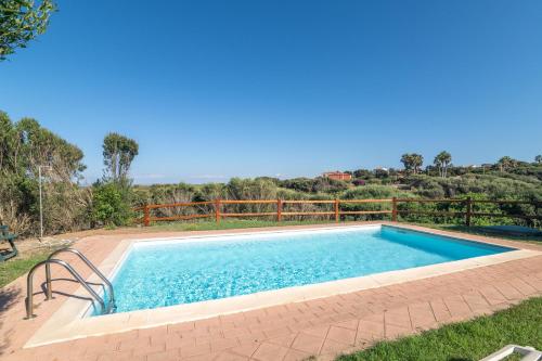 a swimming pool in the backyard of a house at Villa Selena in Cuile Pazzoni