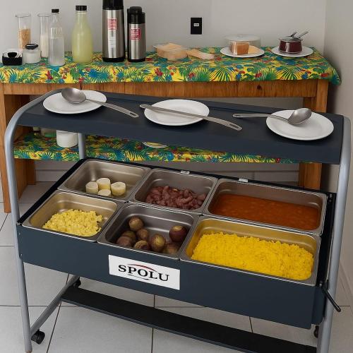 a food cart with different types of food on it at Pousada Bomfim in Maceió