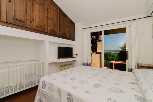 Ένα ή περισσότερα κρεβάτια σε δωμάτιο στο Villa Cala Serena