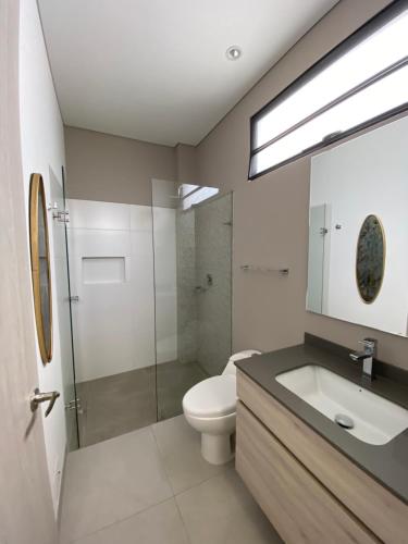 a bathroom with a toilet and a sink and a shower at Maison Eden in Armenia