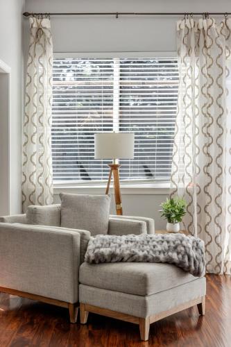 a living room with a couch and a window at New Reno Retreat 72 Inch TV Office Patio Views in Reno