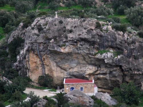 a church on the side of a rocky mountain at Villa Marika in Ierápetra