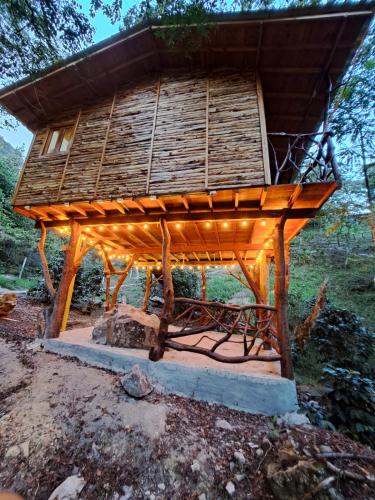 a wooden structure with lights on top of it at Ana Lucia-Casa del arbol in Aratoca