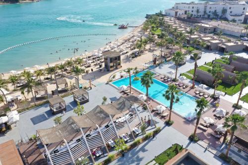 an aerial view of a beach and a resort at Shades Beach Club in Jeddah