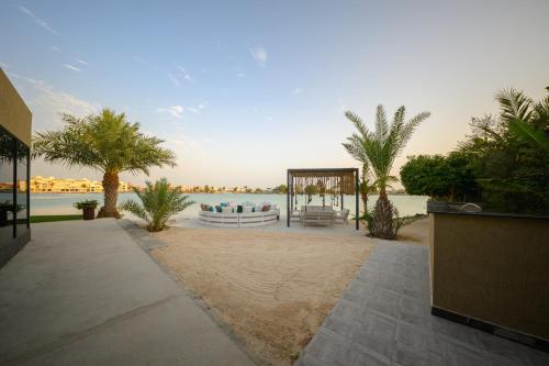 a gazebo with a gazebo on a beach next to at Shades Beach Club in Jeddah