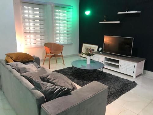 Μια τηλεόραση ή/και κέντρο ψυχαγωγίας στο Appartement Performance luxury HOUEYIHO