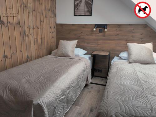 Postel nebo postele na pokoji v ubytování Vila RUNA