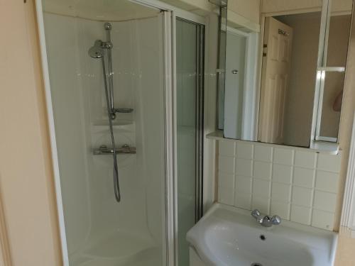 a bathroom with a shower and a sink at Beautiful scenery in Startforth