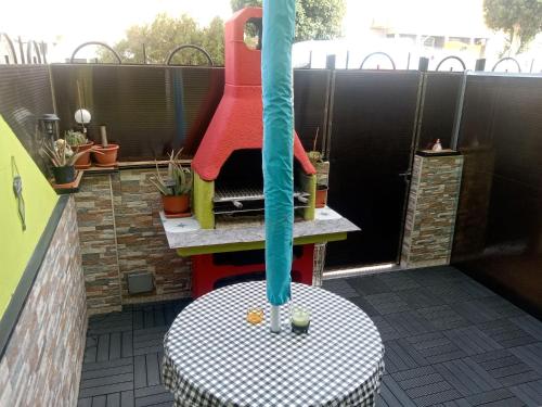 a water fountain on a patio with a table at Christian in Cruce de Arinaga