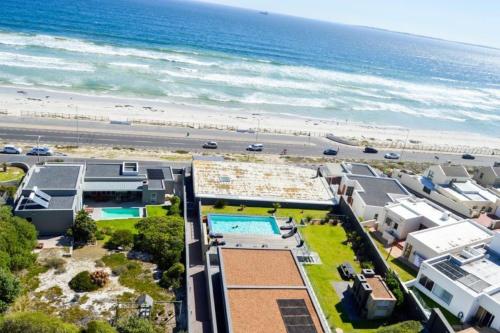 an aerial view of a beach with condos at Infinity Self Catering Beachfront Apartment 302 in Cape Town