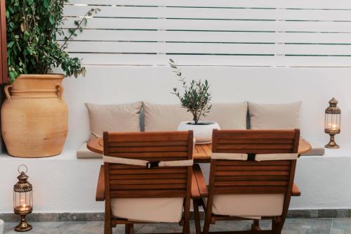 a dining room with a table and two chairs at Lindos Zen luxury villa in Líndos