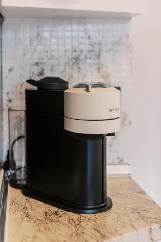 a black and white coffee maker on a counter at Lindos Zen luxury villa in Líndos