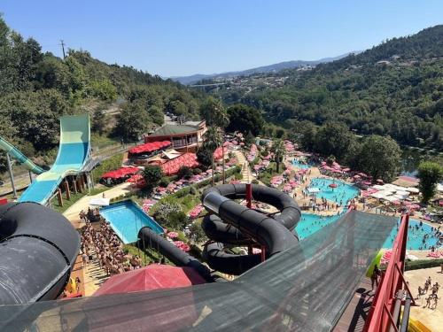an amusement park with a water slide and a pool at Sta Luzia Villa Douro in Amarante