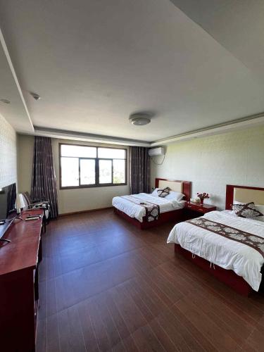 Voodi või voodid majutusasutuse Jia Heng Holiday Inn Hotel toas