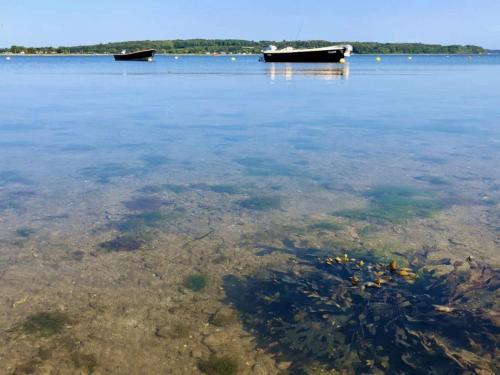 a large body of water with a boat in it at 8 person holiday home in Haderslev in Haderslev