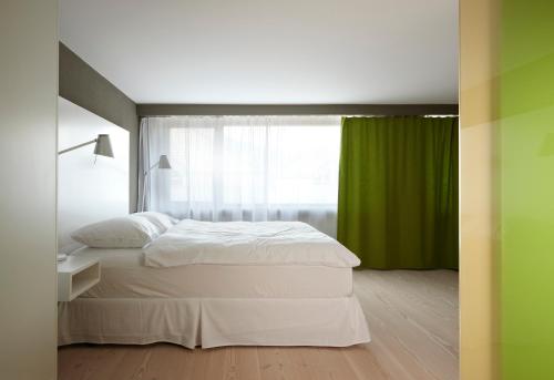 
Ein Bett oder Betten in einem Zimmer der Unterkunft Hotel Restaurant Rössli
