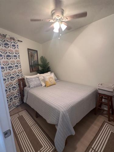 a bedroom with a bed and a ceiling fan at 'It's All Good!' in Corpus Christi