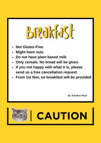 a picture of a yellow sign with a cat on it at 6 Erebus Lodge in Lake Tekapo