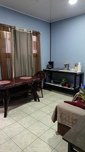 a living room with a ping pong table in it at HOUSE Of Rainbow in Tortuguero